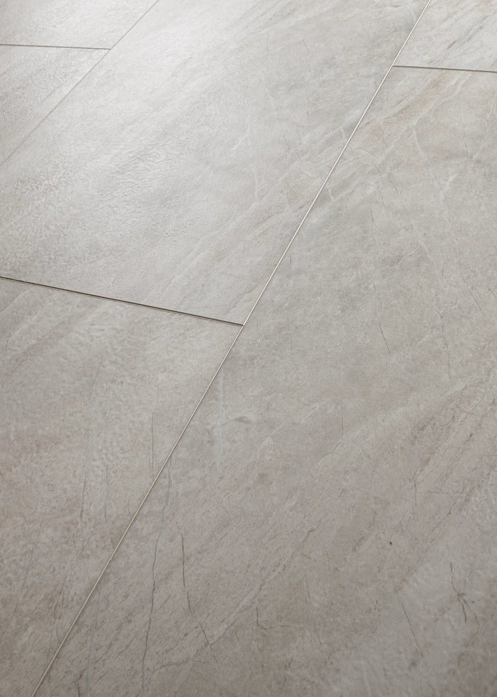 COREtec CRT01 Natural Opula Graphite Travertine waterproof luxury vinyl tile close-up deep dark charcoal travertine stone veining 18x36