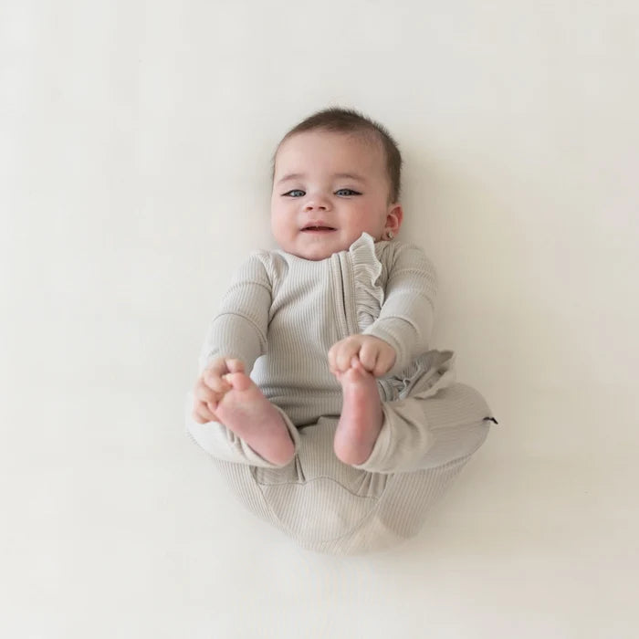 Kyte Baby - Ribbed Ruffle Zipper Romper in Oat